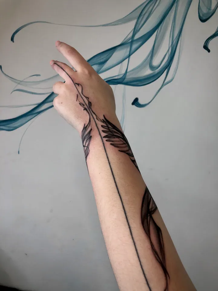 Abstract tattoos with flowing lines on the forearm