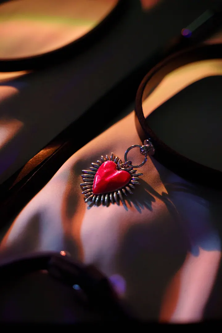 Red heart pendant with metal details