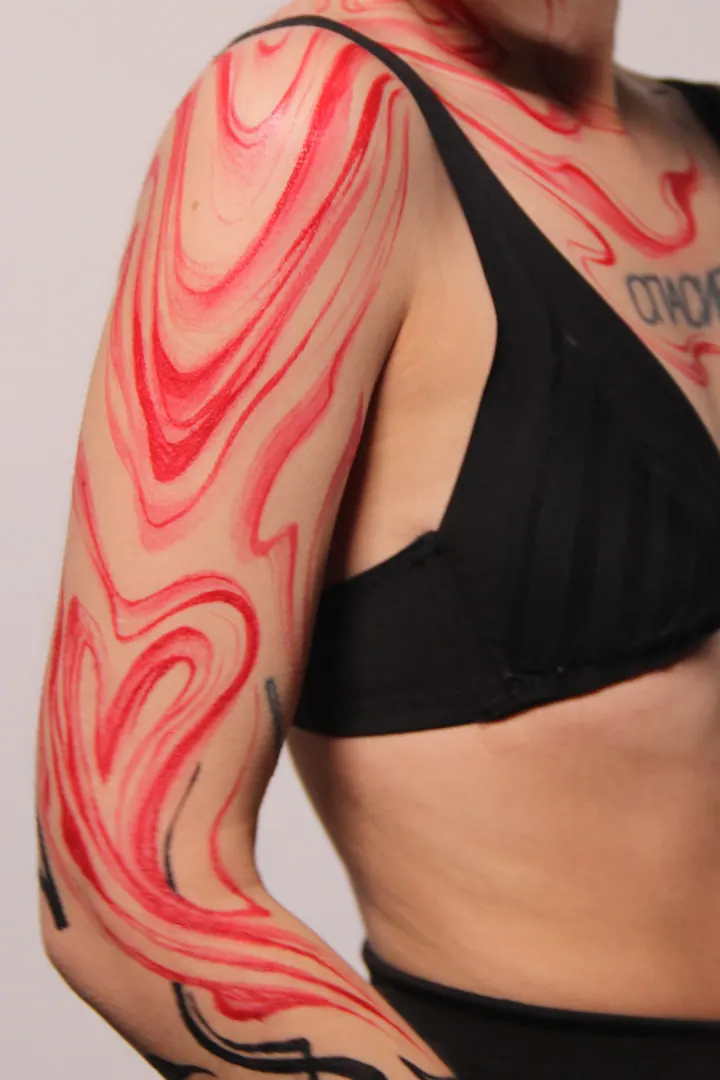 Flowing red and black body painting