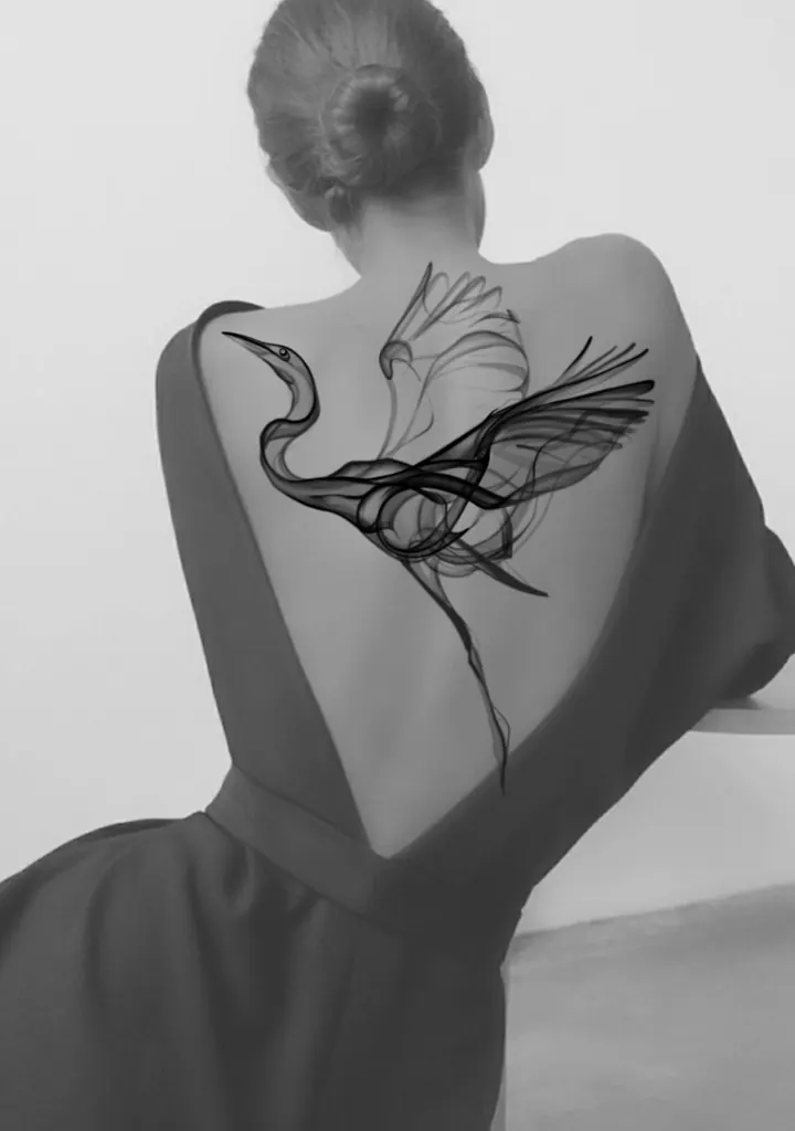 Flying crane tattoo design shown across the back